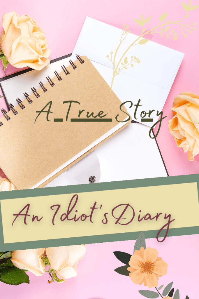 A diary laying on a pink background with beautiful flowers. It is an idiot's diary, though.